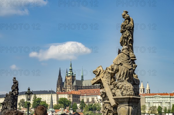 Statue of Madonna and Saint Bernard on Charles Bridge in front of Prague Castle, Prague, Czech Republic