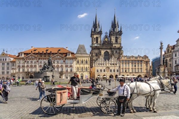 Horse-drawn carriage and Tyn church on Old Town Square in the Old Town of Prague, Prague, Czech Republic