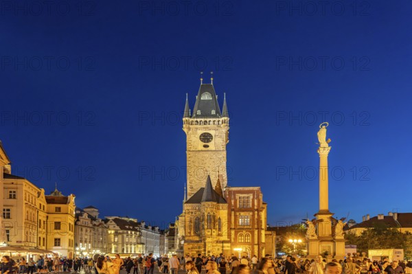Old Town Town Hall and St. Mary's Column on Old Town Square at dusk, Prague, Czech Republic