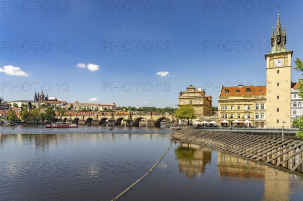 City view of Prague with Vltava River, Old Town Water Tower, Novotný Bridge, Castle and Charles Bridge in Prague, Czech Republic