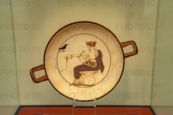Plate Apollo and the Raven in the Archaeological Museum of Delphi, UNESCO World Heritage Site in Delphi, Greece