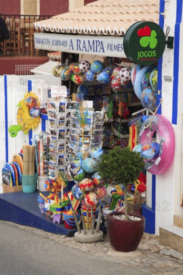 Souvenir shop in the town of Carvoeiro, Algarve, Portugal, A small shop with souvenirs, colorful beach balls and toys that creates a summer holiday atmosphere