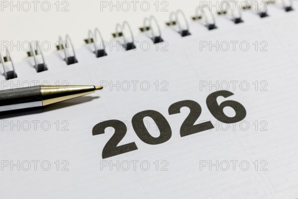 Ringbook calendar, calendar sheet for the year 2026 with a black pen next to it