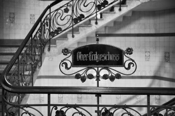 Interior view, sign upper ground floor, art nouveau, staircase, Alsterhaus, black and white, Free and Hanseatic City of Hamburg, Germany