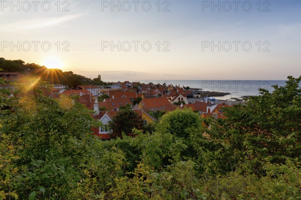 View of Gudhjem, view over the roofs of the Baltic Sea, sunset, sunbeams, Gudhjem, Bornholm, Baltic Sea, Denmark