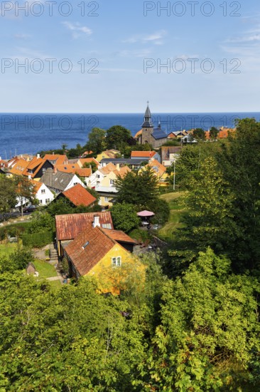 View of Gudhjem, view over the roofs and the church to the Baltic Sea with Christiansø, Christiansö on the horizon, Gudhjem, Bornholm, Baltic Sea, Denmark