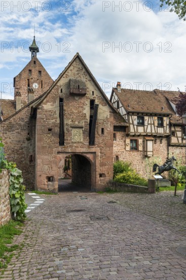 The entrance portal on the city wall of the historic town of Riquewihr, Ellsass