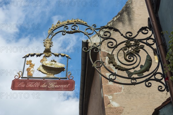 Guild sign for a restaurant in Riquewihr, Alsace