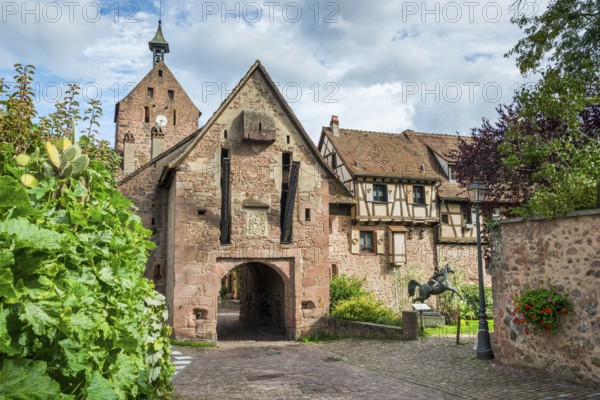 The entrance portal on the city wall of the historic town of Riquewihr, Ellsass