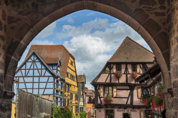 Decorated half-timbered houses at the entrance to the historic old town of Riquewihr, Ellsass