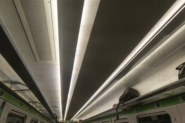 Pattern formed by stripes of ceiling lighting inside GWR InterCity Express train carriage, UK