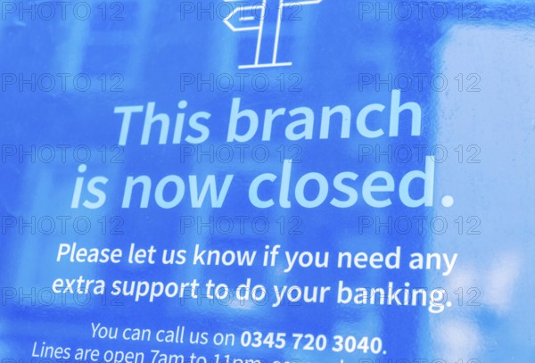 This branch is now closed message in window of branch of shut Barclays bank, UK