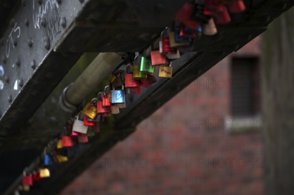 Colourful, colorful love locks hang on a bridge, warehouses, brick buildings, Hamburger Speicherstadt, Hafencity, Free and Hanseatic City of Hamburg, Germany