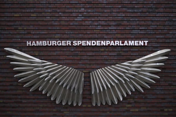 Exterior photo logo, wing, swing, Hamburg donation parliament, lettering, façade, warehouses, brick buildings, Hamburg Speicherstadt, Hafencity, Free and Hanseatic City of Hamburg, Germany