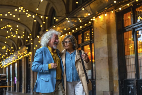 Senior couple walking arm in arm under string lights, happily talking while enjoying an evening out in the city, representing love, companionship, and a vibrant active lifestyle in retirement