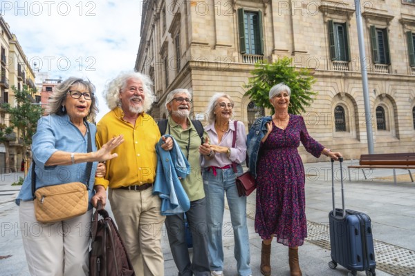 Happy senior friends walking through a sunny european city street with luggage, smiling and enjoying summer vacation, sightseeing, leisure and active retirement together