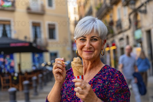 Senior woman smiling while enjoying an ice cream cone on a sunny european city street, relaxed and confident during summer travel and leisurely urban exploring