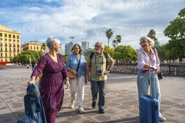 Group of senior friends happily walking together through a city exploring new destinations, enjoying their vacation and an active retirement lifestyle