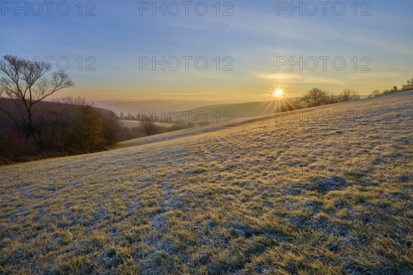 A sunny, frosty morning with a view of a hilly landscape, Seckmauern, Lützelbach, Maintal, Odenwald, Hesse, Germany
