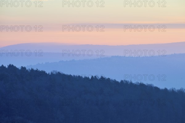 Shady hills and a calm pastel sky at sunset create a quiet atmosphere, Seckmauern, Lützelbach, Maintal, Odenwald, Hesse, Germany