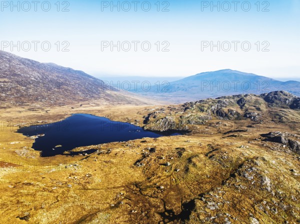 Autumn colours over Llyn Cwmffynnon and Miner's Track, Start Point, road A4086 from a drone, Pen-y-Pass, Snowdonia, Wales, UK