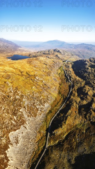 Autumn colours over Llyn Cwmffynnon and Miner's Track, Start Point, road A4086 from a drone, Pen-y-Pass, Snowdonia, Wales, UK