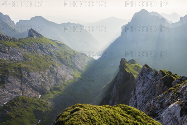 View over Alpstein Mountains into the Meglisalp Valley at sunrise, Rotstein Pass, Säntis, Appenzell, Switzerland