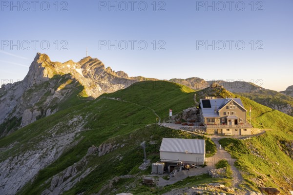 Mountain hut on the Rotstein Pass with a view of the Lisengrat and the summit of the Säntis, Alpstein, Appenzell, Switzerland