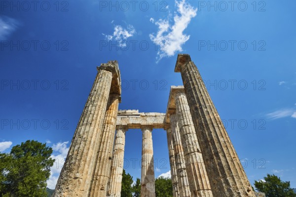 Pillars of an ancient ruin against a blue sky, Nemea, Ancient Zeus Heightum, Archaeological Site, Peloponnese, Greece