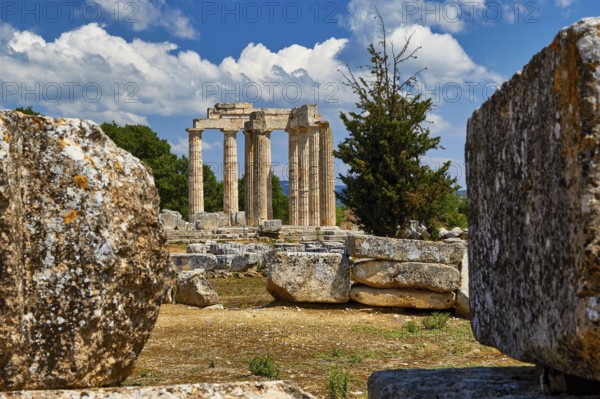 Ancient Greek ruins with columns under a blue sky with clouds, Nemea, Ancient Zeus Heightum, Archaeological Site, Peloponnese, Greece