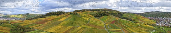 Panoramic view of hilly vineyards under cloudy sky, with autumn colors, near Strümpfelbach im Remstal, Rems-Murr-Kreis, Baden-Württemberg, Germany
