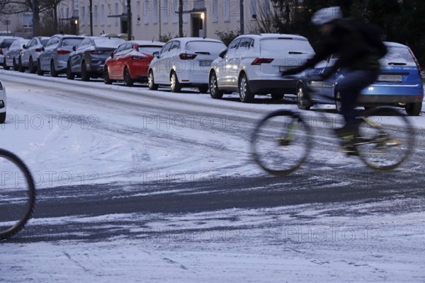 Winter, slippery roads with snow and ice, slippery roads, cyclists, Germany