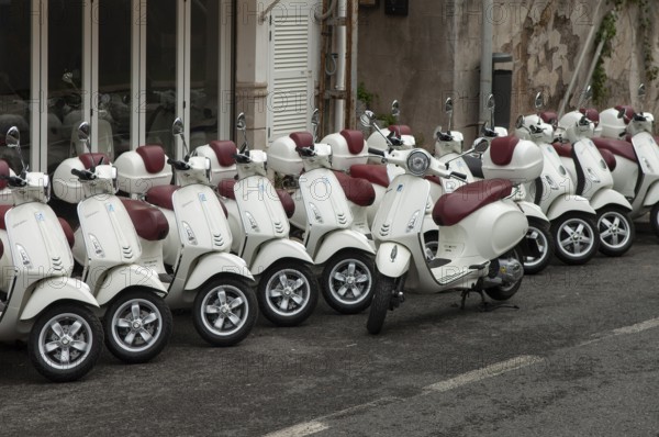 Many scooters for rent are in front of a shop, Port de Soller, Majorca, Spain