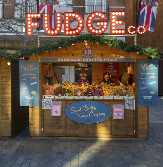 Fudge Christmas market wooden shed market stall in city centre, Exeter, Devon, England, UK