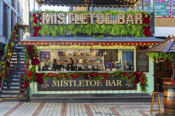 Mistletoe Bar Christmas market wooden shed market stall in city centre, Exeter, Devon, England, UK