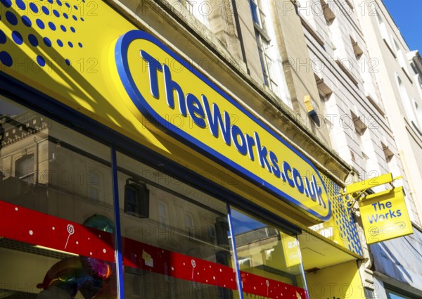 Sign for The Works shop store in city centre, High Street, Exeter, Devon, England, UK