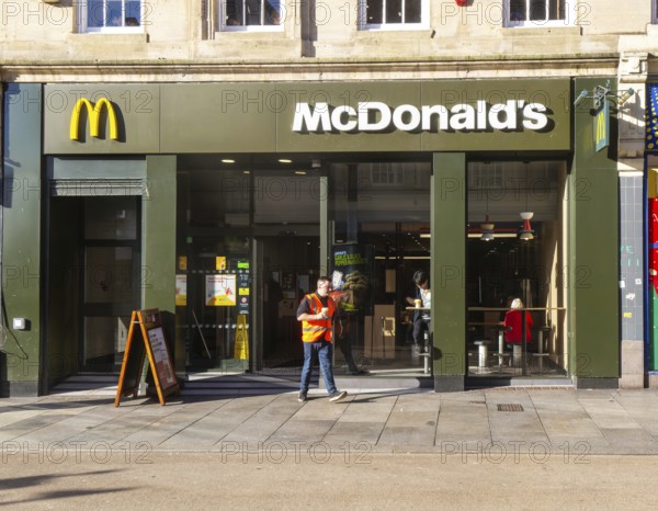 McDonalds fast food takeaway restaurant, High Street, Exeter, Devon, England, UK