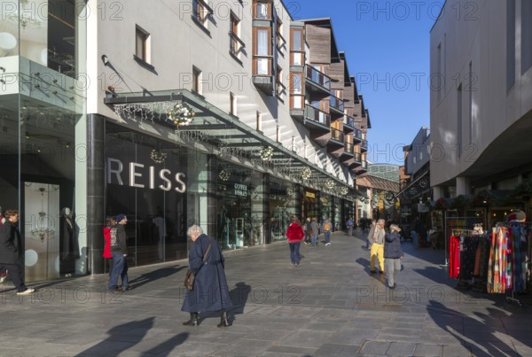 Shoppers walking past Reiss shop store in city centre, Princesshay, Exeter, Devon, England, UK