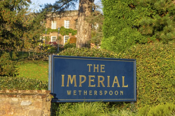 Sign in garden of The Imperial Wetherspoon pub, Exeter, Devon, England, UK