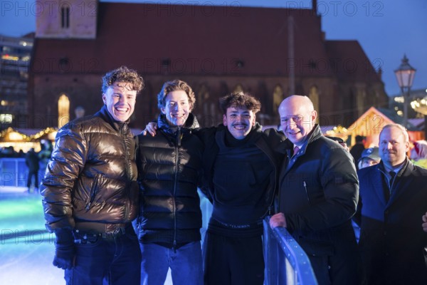 Kai Wegner, Governing Mayor of Berlin, has himself photographed with three skaters at the opening of the Berlin Christmas market on Alexanderplatz, Berlin, 24.11.2025