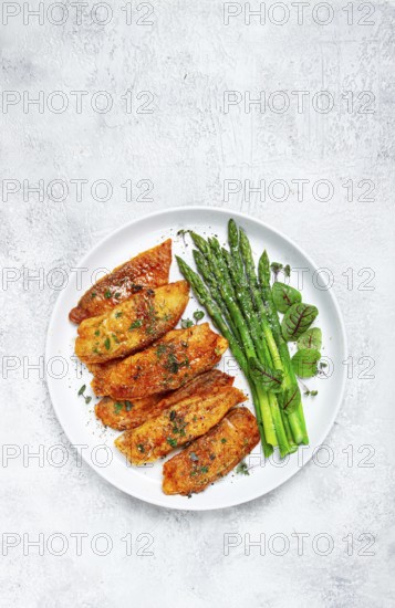 Fried fish fillet, tilapia with asparagus, homemade, no people