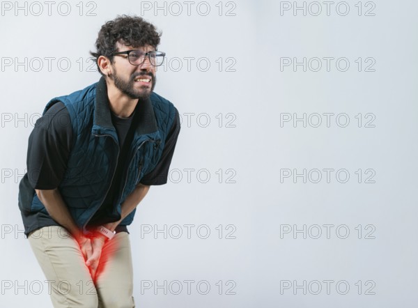 Person with medical problem urinary. Male with hands on crotch with urinary problems. Young woman with hemorrhoids problems