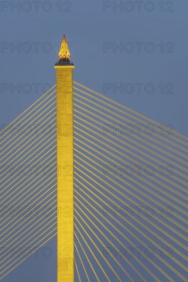 The illuminated Rama VIII Bridge, a cable-stayed bridge across Mae Nam Chao Praya, Bangkok, Thailand