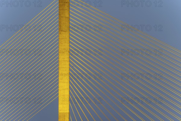 The illuminated Rama VIII Bridge, a cable-stayed bridge across Mae Nam Chao Praya, Bangkok, Thailand