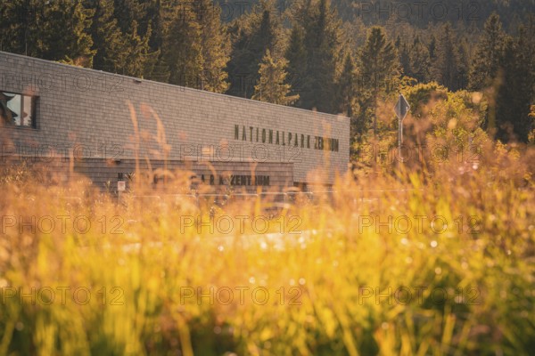 National Park Center building in front of autumn forest in sunlight, Ruhestein National Park Center, Black Forest, Baiersbronn, Germany