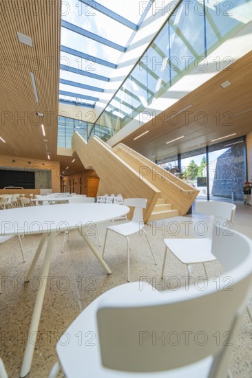 Bright room with glass walls and wooden staircase, modern interior design, Ruhestein National Park Center, Black Forest, Baiersbronn, Germany