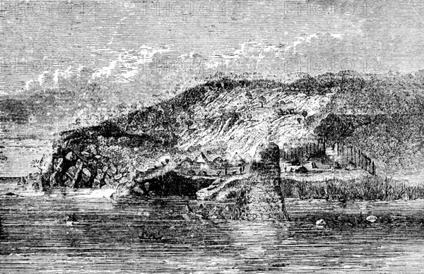 Small village with reed huts on Lake Tanganyika, lake shore, mountain landscape, rocks, wooden huts, lonely, clouds, Tanzania, Africa, travel, historical illustration around 1900