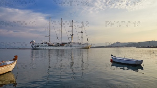 Port of Nauplion, A large sailing ship is lying in a calm sea, surrounded by smaller boats, under a cloudy sky, Nauplion, Nafplion, Peloponnese, Greece
