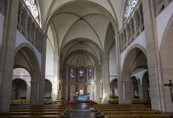 Large church interior view with arches, glass windows and altar in a quiet atmosphere, Boniface Monastery, Hünfeld, Konrad-Zuse City, Hesse, Germany