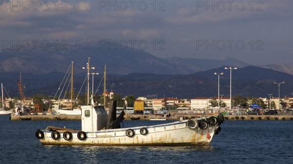 Nauplion harbour, white boat in harbour with mountains in background, Nauplion, Nafplion, Peloponnese, Greece